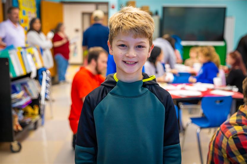 A boy smiles